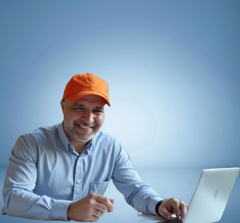 Mohan Gulati working on a laptop